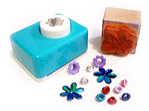 Clockwise from top left: decorative hole punch, ink stamp, eyelets.
